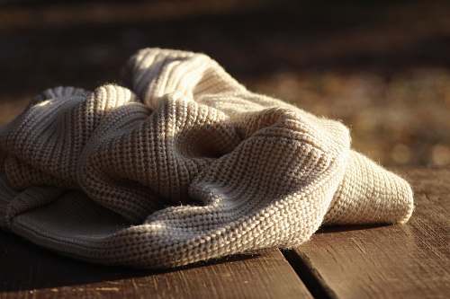 blanket white textile on wooden plank brooksville